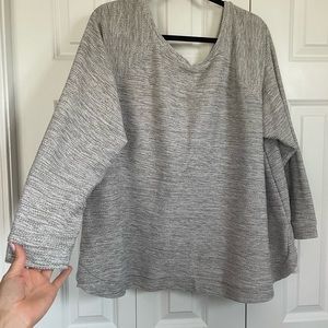 Woman’s grey sweater